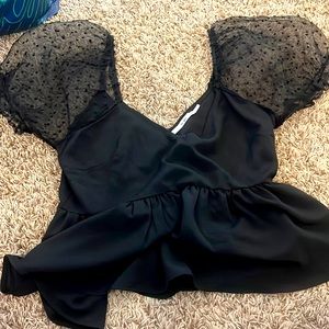 Black francesca’s puffy short sleeved top.